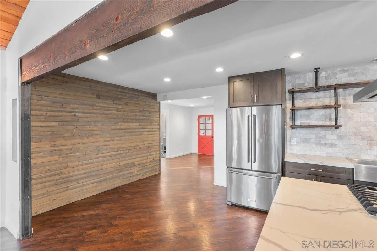 9307 Dalehurst Road Santee, CA 92071 - Photo 10 of 46 a view of a refrigerator in kitchen and wooden floor