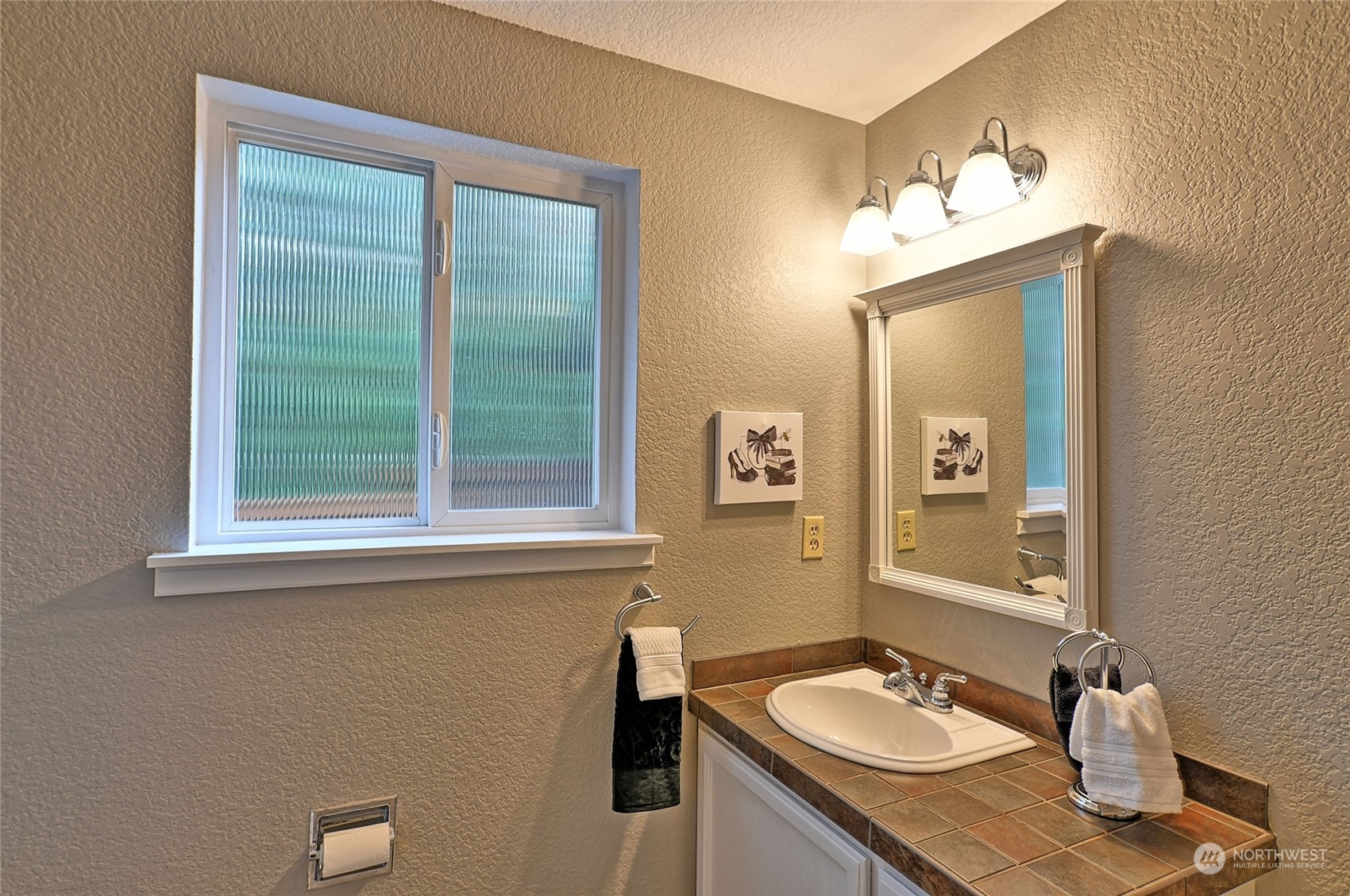 2429 243rd Place Southwest Bothell, WA 98021 - Photo 17 of 40 a bathroom with a sink vanity and mirror