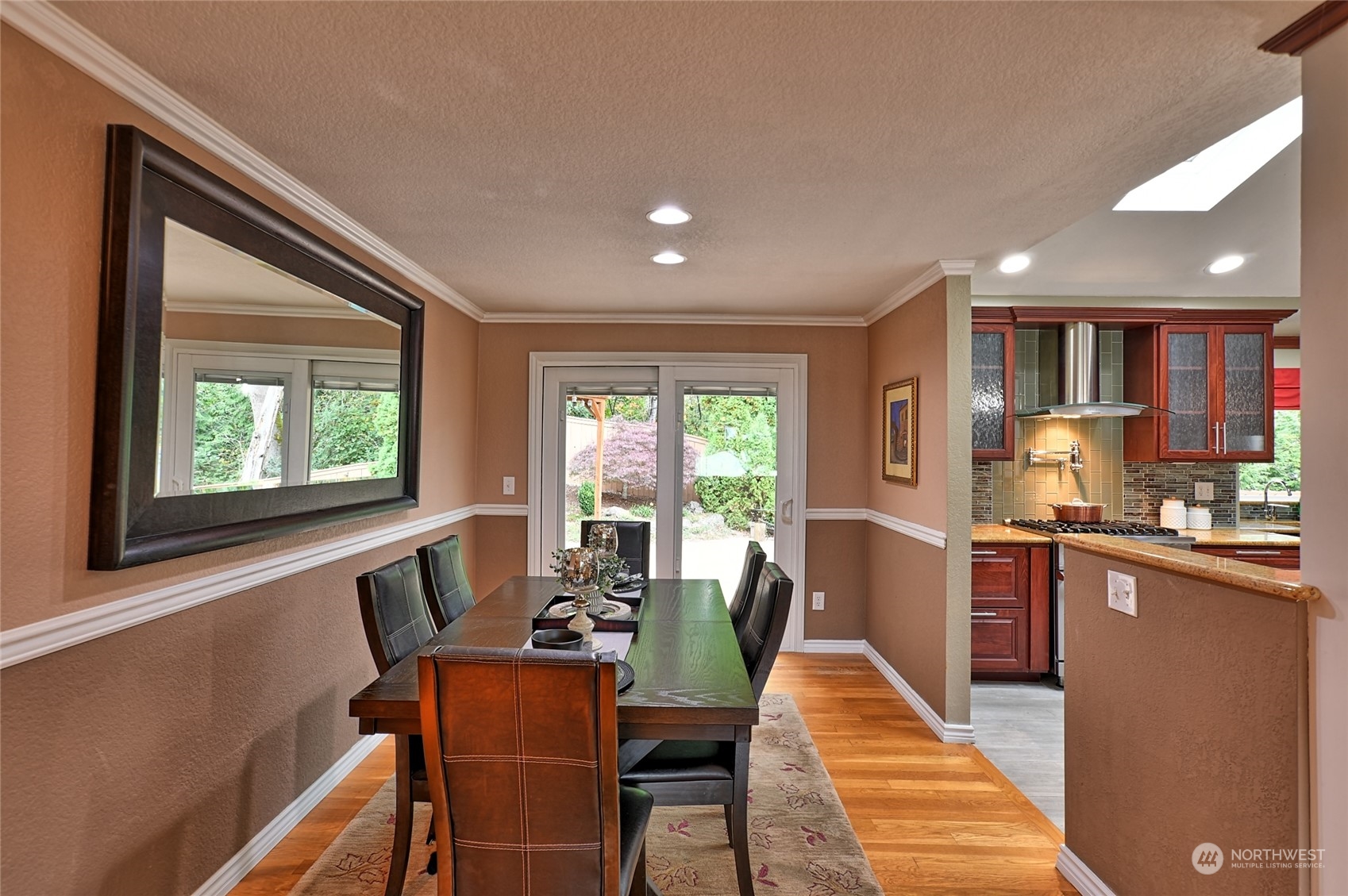 2429 243rd Place Southwest Bothell, WA 98021 - Photo 8 of 40 a dining room with furniture and large windows