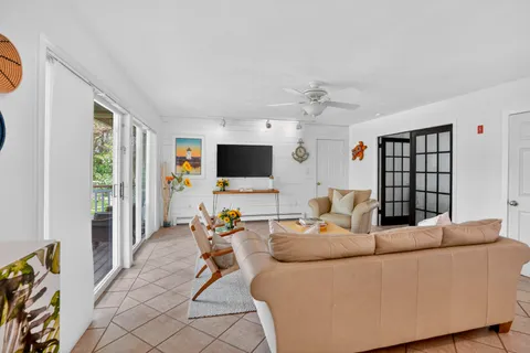 a living room with furniture and a rug