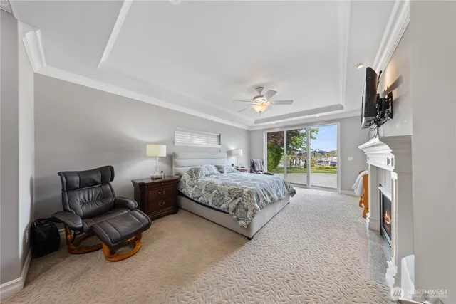 a bedroom with furniture and a flat screen tv