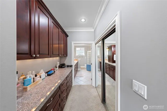a kitchen with granite countertop stainless steel appliances and wooden cabinets