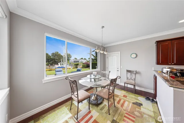 a view of a dining room with furniture window and outside view