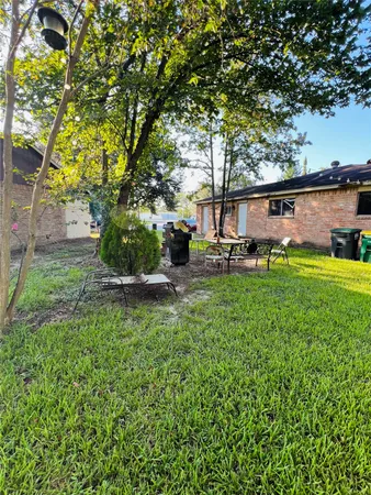 a backyard of a house with lots of green space
