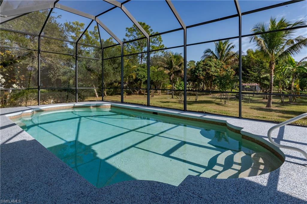 510 13th Street Northwest Naples, FL 34120 - Photo 11 of 50 a view of a swimming pool with a patio
