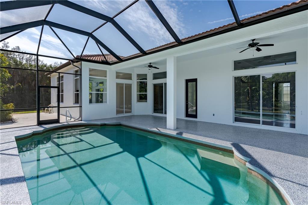510 13th Street Northwest Naples, FL 34120 - Photo 12 of 50 a swimming pool with yard in front of it