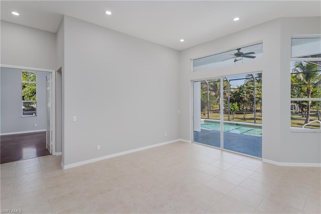 510 13th Street Northwest Naples, FL 34120 - Photo 16 of 50 an empty room with windows and entrance