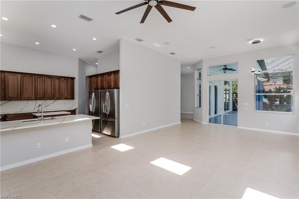 510 13th Street Northwest Naples, FL 34120 - Photo 50 of 50 a view of kitchen with stainless steel appliances a refrigerator and a stove top oven