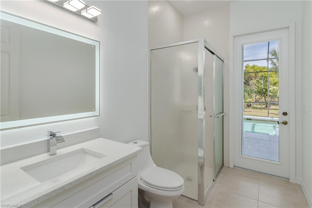 510 13th Street Northwest Naples, FL 34120 - Photo 28 of 50 a bathroom with a sink toilet vanity and shower