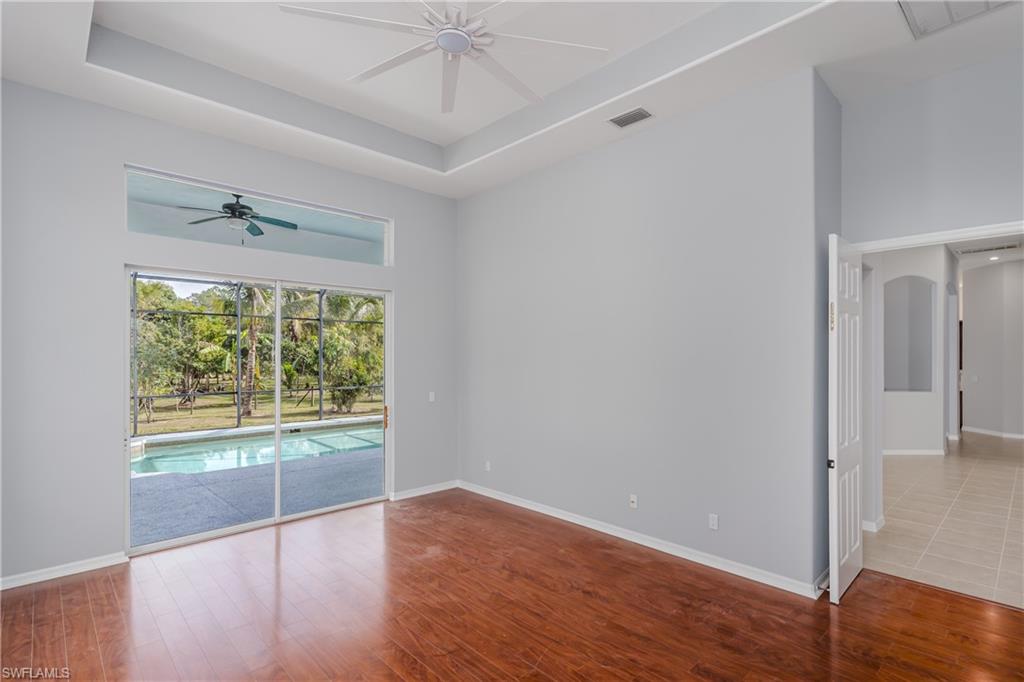 510 13th Street Northwest Naples, FL 34120 - Photo 30 of 50 wooden floor in an empty room with a window