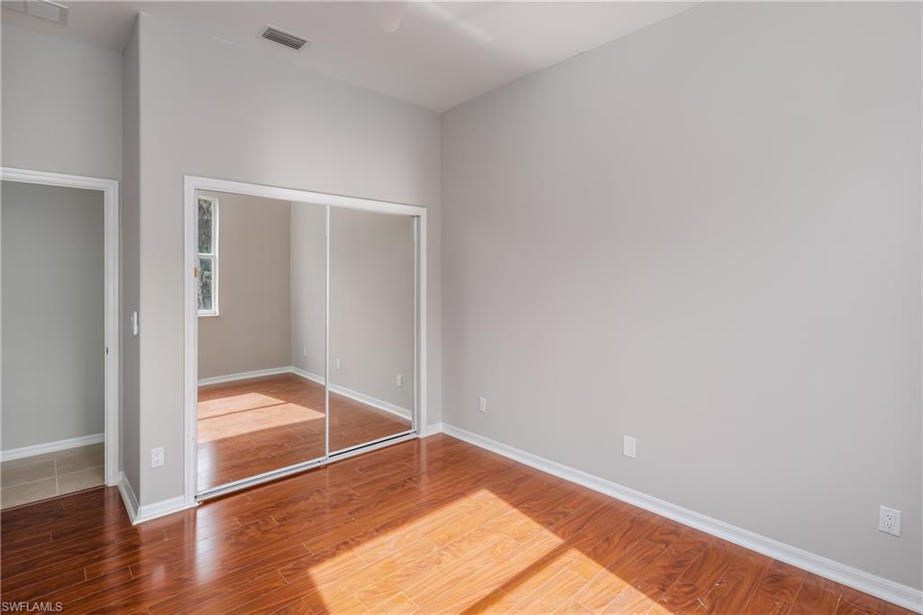 510 13th Street Northwest Naples, FL 34120 - Photo 35 of 50 a view of empty room with wooden floor