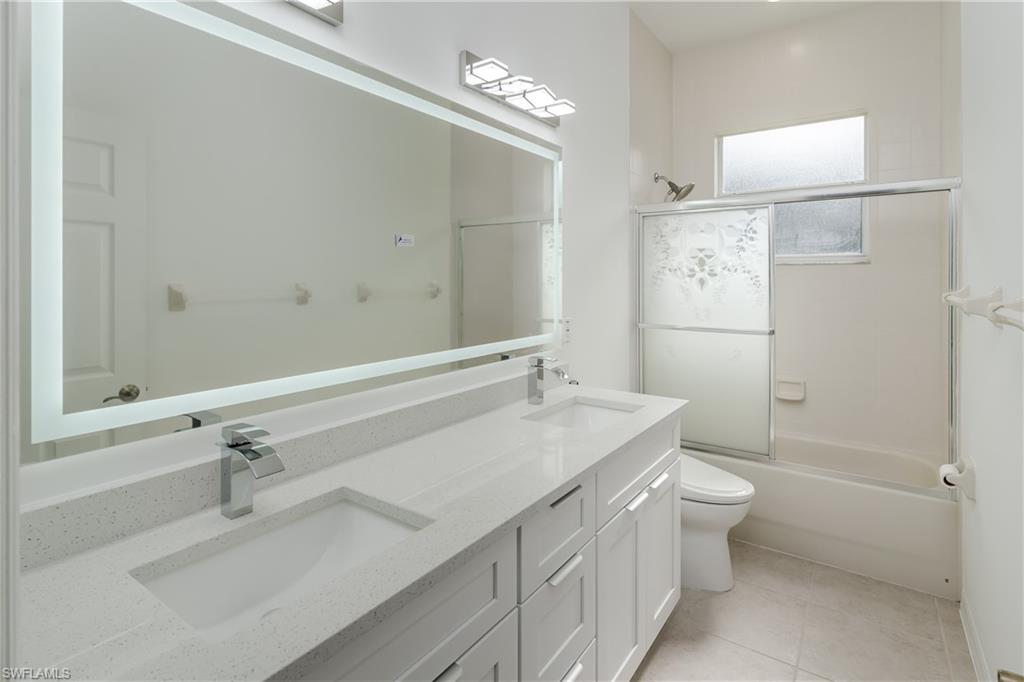 510 13th Street Northwest Naples, FL 34120 - Photo 36 of 50 a bathroom with a sink toilet and shower