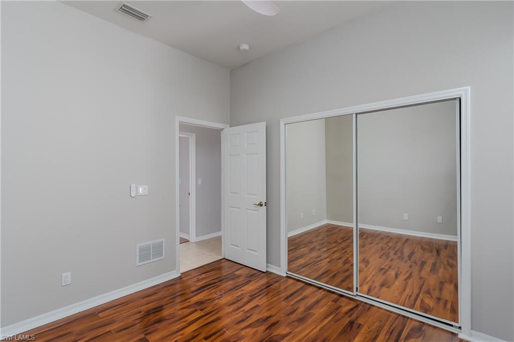 510 13th Street Northwest Naples, FL 34120 - Photo 40 of 50 a empty room with wooden floor