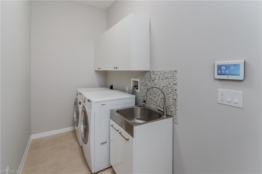 510 13th Street Northwest Naples, FL 34120 - Photo 41 of 50 a utility room with dryer and washer