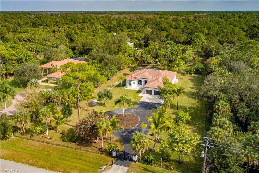 510 13th Street Northwest Naples, FL 34120 - Photo 43 of 50 a view of a yard with swimming pool