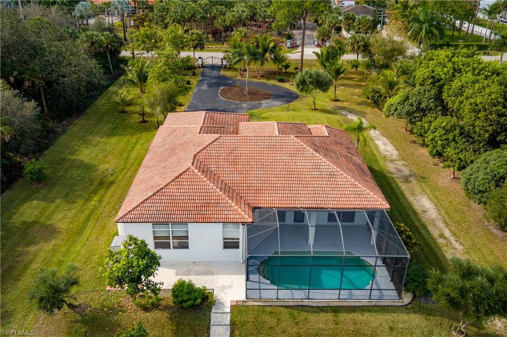 510 13th Street Northwest Naples, FL 34120 - Photo 49 of 50 an aerial view of a house with swimming pool