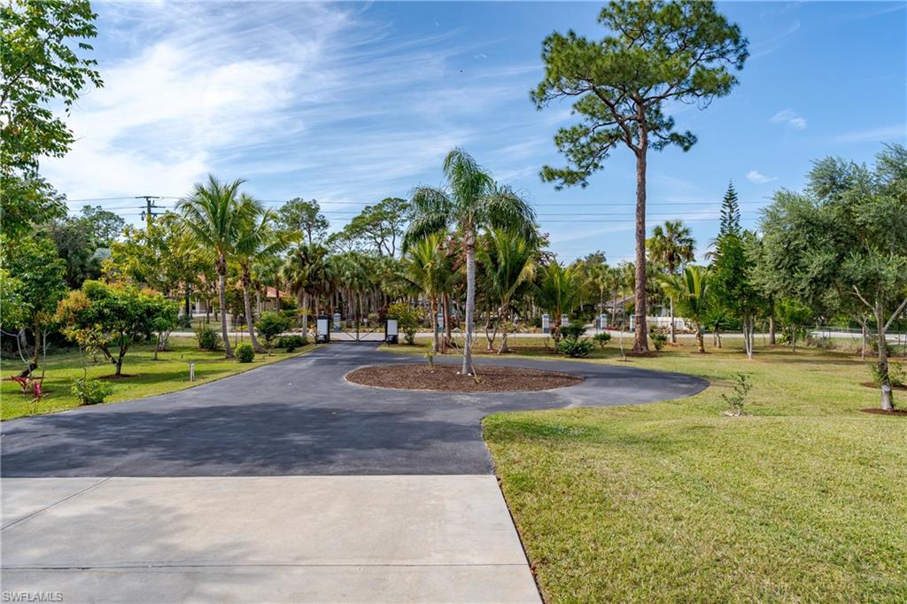 510 13th Street Northwest Naples, FL 34120 - Photo 6 of 50 a view of a swimming pool with an outdoor space and seating area