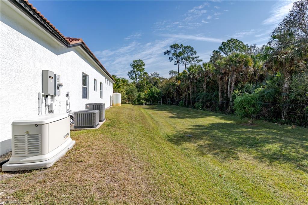 510 13th Street Northwest Naples, FL 34120 - Photo 7 of 50 a view of a house with a yard