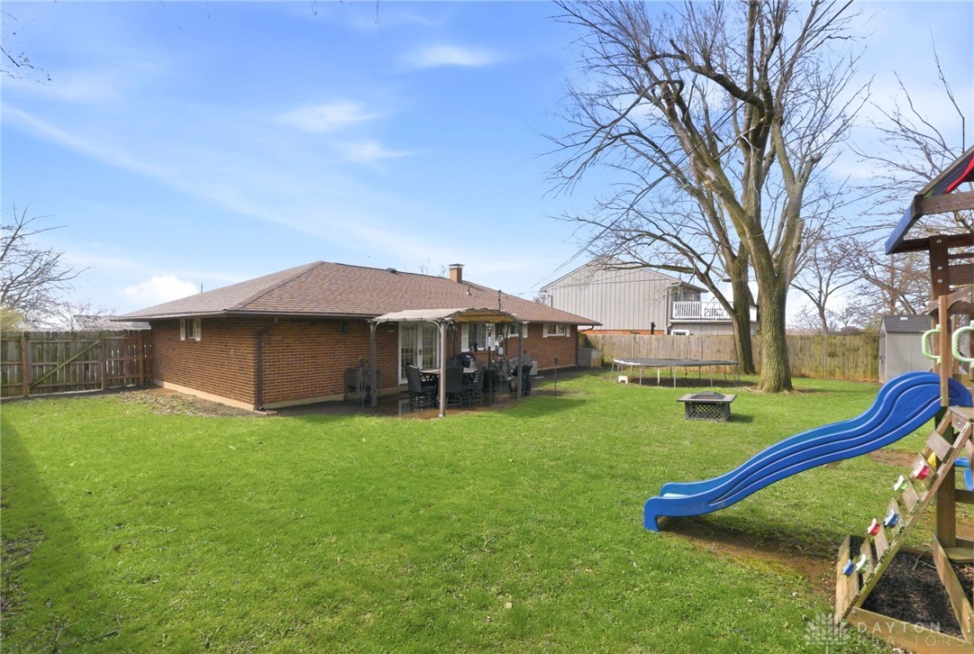 5171 Fishburg Road Dayton, OH 45424 - Photo 31 of 35 This spacious backyard provides ample room for leisure and outdoor activities.