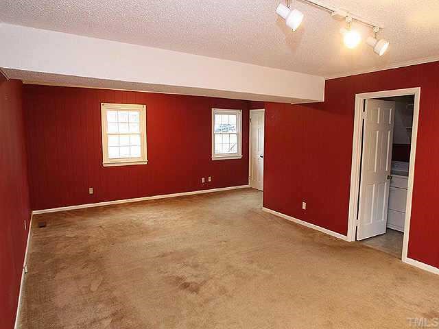 3333 Hampton Road Raleigh, NC 27607 - Photo 8 of 12 an empty room with windows