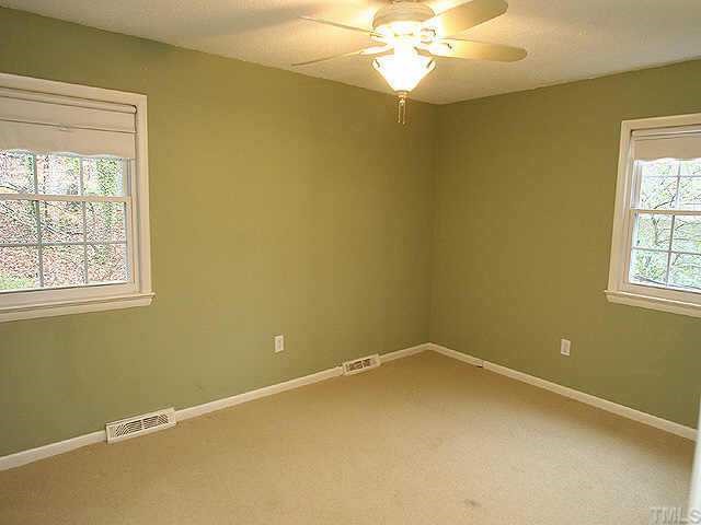 3333 Hampton Road Raleigh, NC 27607 - Photo 9 of 12 a view of a room with a window and chandelier fan