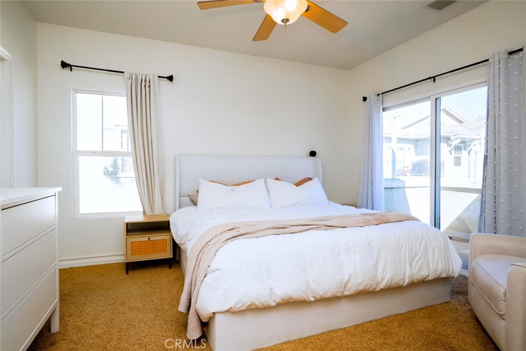 7331 Shelby Place, Unit 91 Rancho Cucamonga, CA 91739 - Photo 16 of 34 a bedroom with a bed and a large window