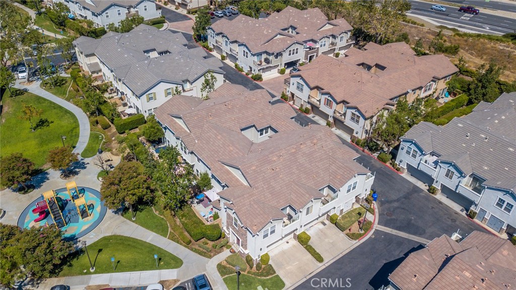 7331 Shelby Place, Unit 91 Rancho Cucamonga, CA 91739 - Photo 30 of 34 an aerial view of a house with a garden and swimming pool