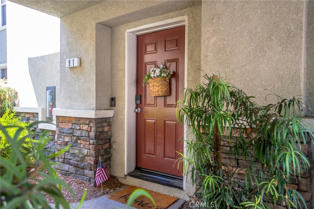 7331 Shelby Place, Unit 91 Rancho Cucamonga, CA 91739 - Photo 4 of 34 a view of a entryway door of the house