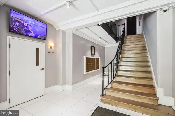 a view of a hallway with chandelier