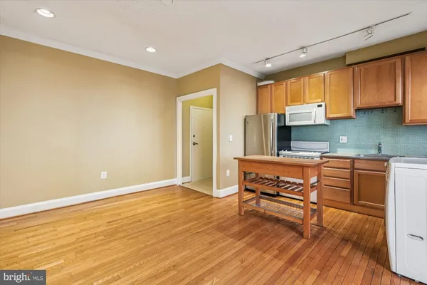 a room with wooden floors and furniture