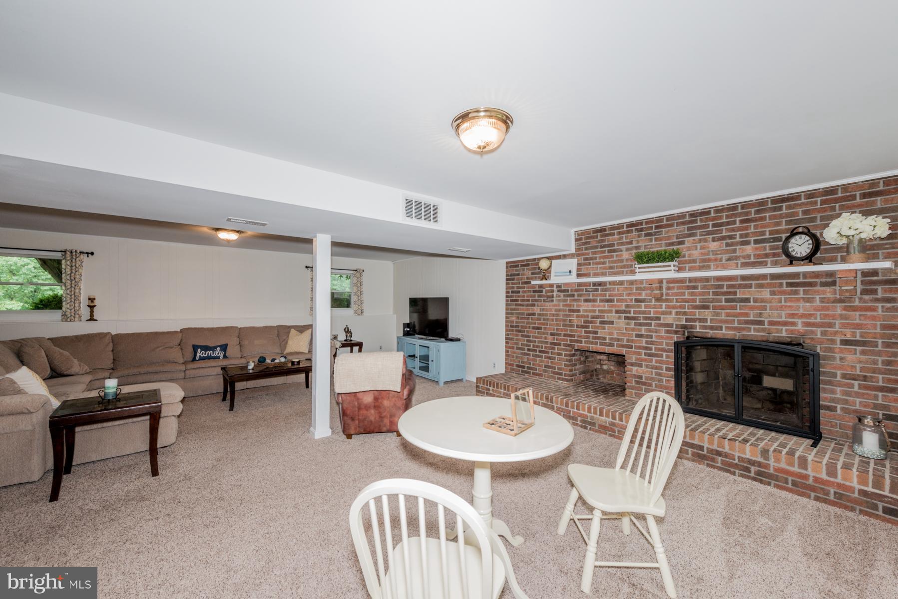 3417 Nottingham Road Westminster, MD 21157 - Photo 22 of 30 Renovated Lower Level Rec Room Wood Burning FP
