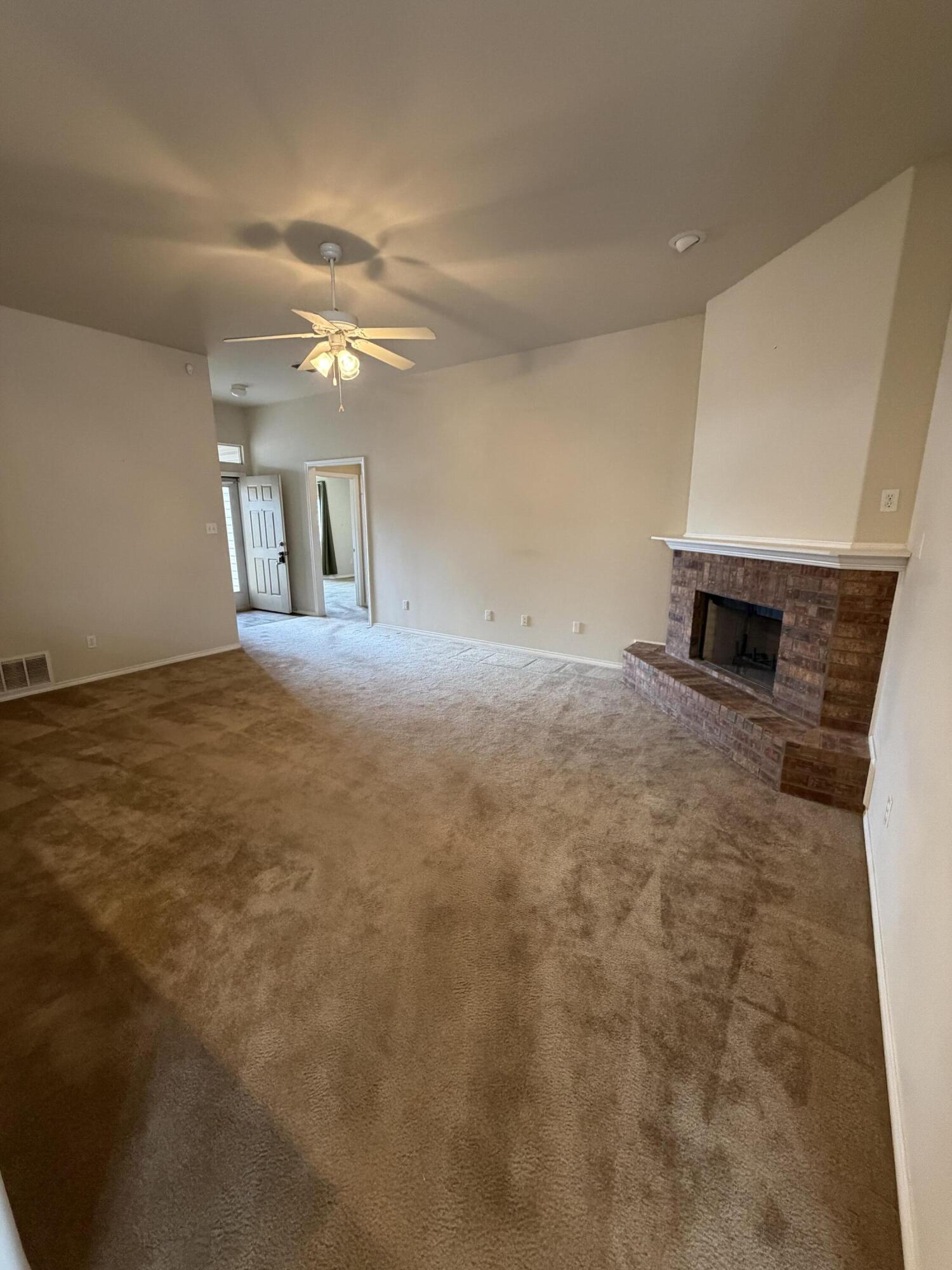 6544 84th Street Lubbock, TX 79424 - Photo 15 of 29 a view of a livingroom with a fireplace
