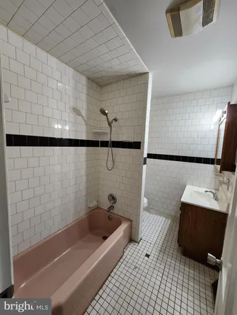 a bathroom with a bathtub and shower