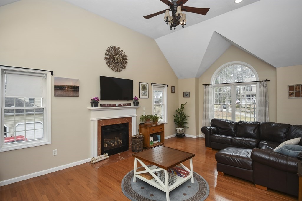 26 Tannery Road Sturbridge, MA 01518 - Photo 3 of 42 a living room with furniture a flat screen tv and a fireplace