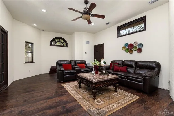 a living room with furniture and a rug