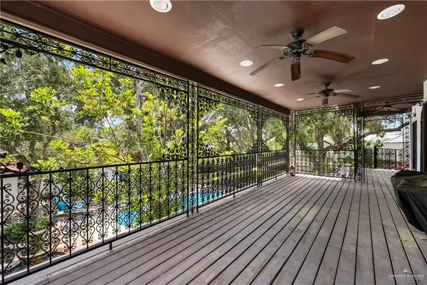 a view of a balcony with wooden floor
