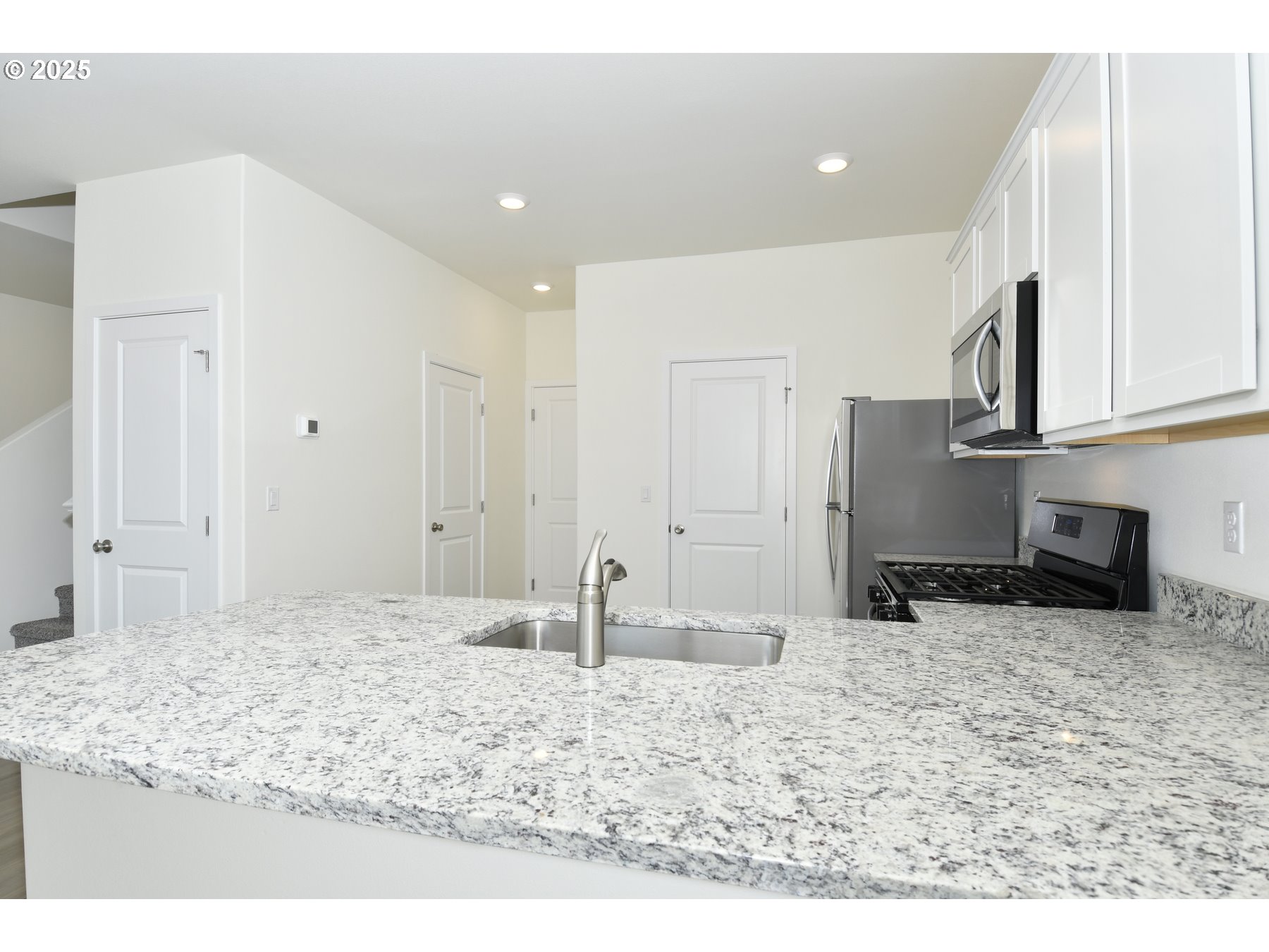 3907 Southwest Duniway Lane Gresham, OR 97080 - Photo 11 of 24 a view of kitchen with stainless steel appliances granite countertop refrigerator sink and stove