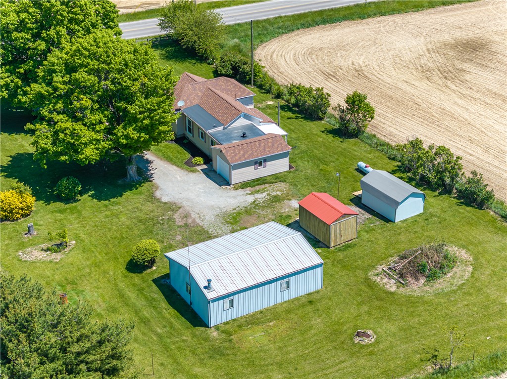 1217 Jasper Road Xenia, OH 45385 - Photo 15 of 62 This aerial view showcases a residential property nestled amidst expansive fields, offering a tranquil rural setting.
