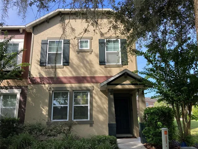 a front view of a house with yard