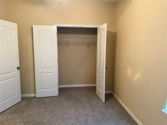 a bathroom with a tub a toilet and a shower