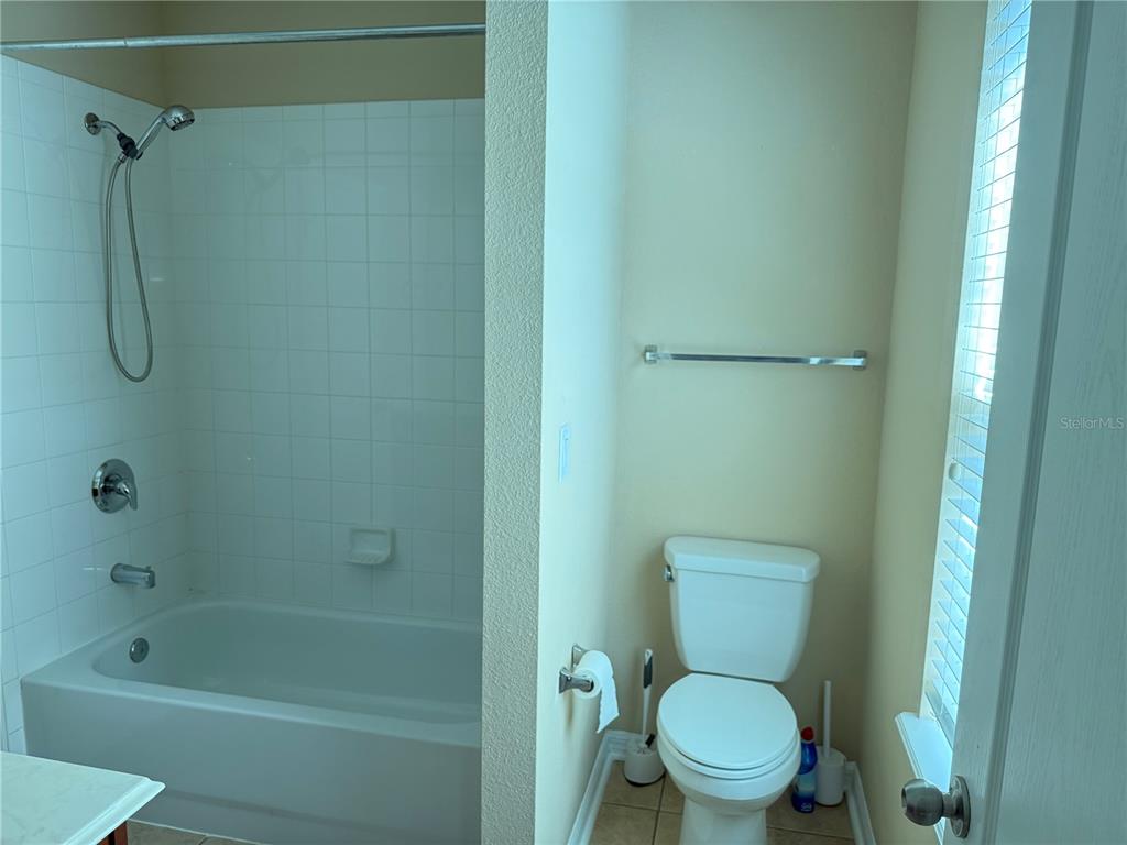 12910 Calderdale Avenue Windermere, FL 34786 - Photo 17 of 24 a bathroom with a toilet and a shower