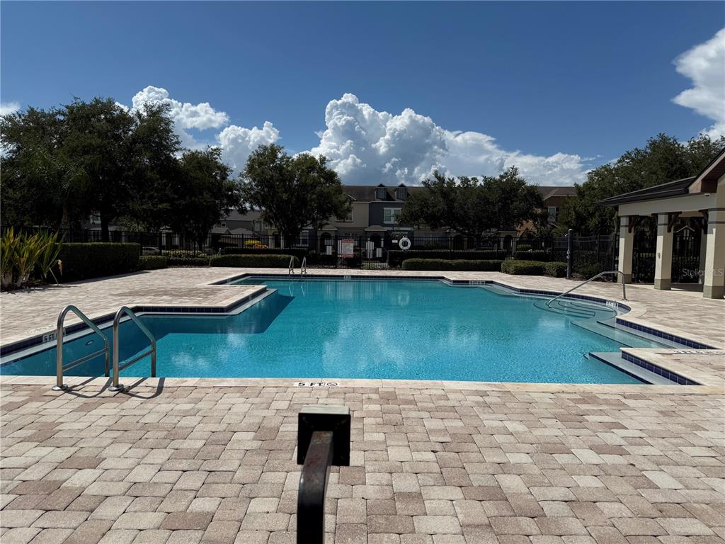 12910 Calderdale Avenue Windermere, FL 34786 - Photo 23 of 24 a view of a swimming pool with a lounge chairs