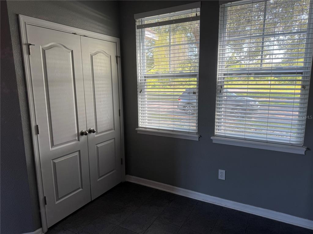 12910 Calderdale Avenue Windermere, FL 34786 - Photo 5 of 24 a view of an empty room with a window