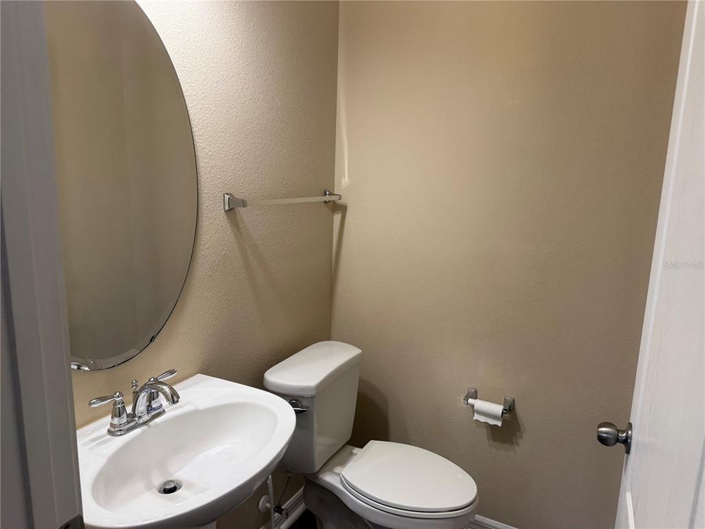12910 Calderdale Avenue Windermere, FL 34786 - Photo 6 of 24 a bathroom with a sink mirror and toilet