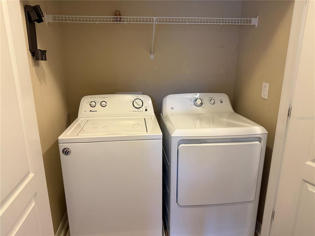 12910 Calderdale Avenue Windermere, FL 34786 - Photo 7 of 24 a utility room with dryer and washer