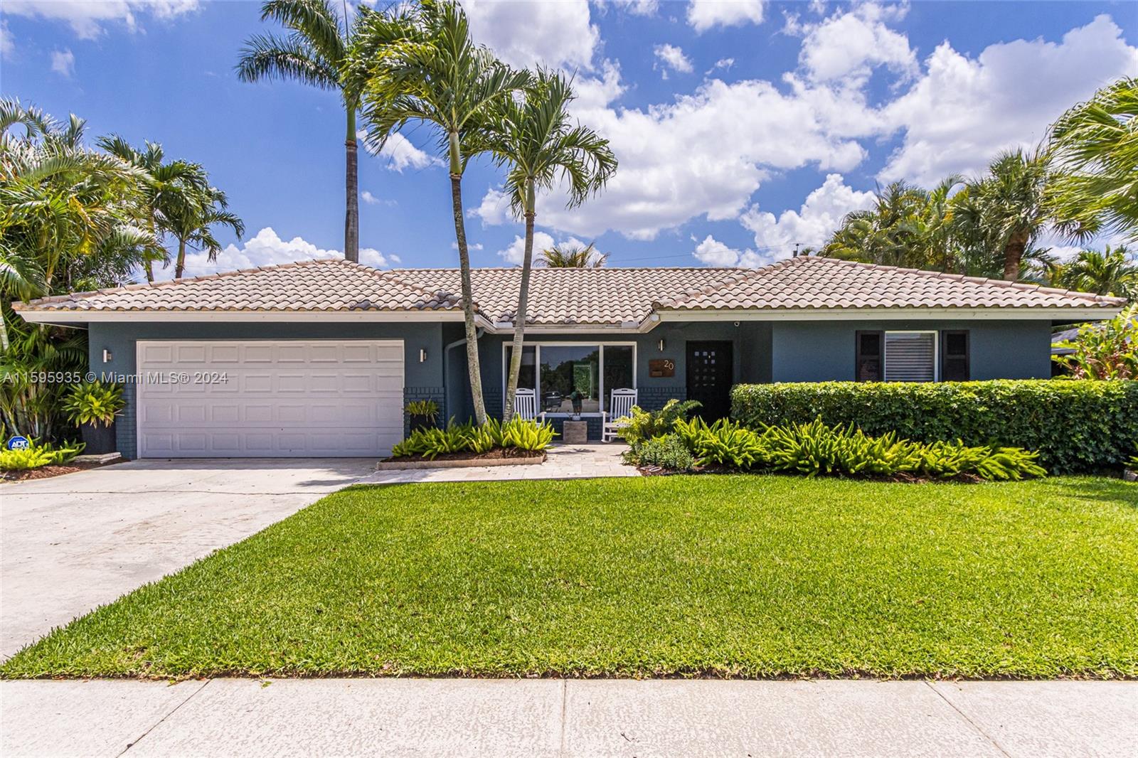 20 Burning Tree Lane Boca Raton, FL 33431 - Photo 1 of 64 a front view of a house with a garden and yard