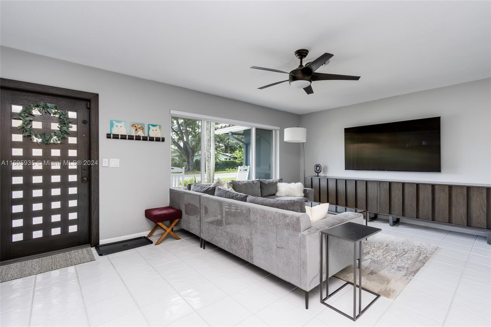 20 Burning Tree Lane Boca Raton, FL 33431 - Photo 17 of 64 a living room with furniture and a flat screen tv