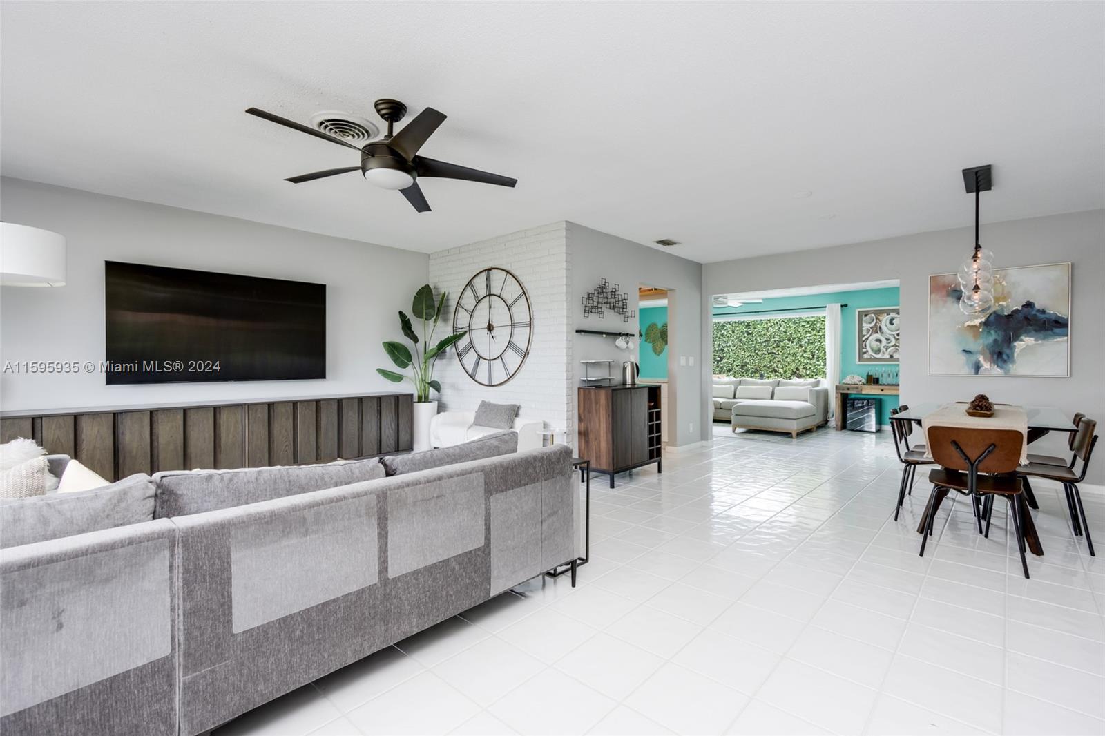 20 Burning Tree Lane Boca Raton, FL 33431 - Photo 18 of 64 a living room with furniture and a flat screen tv