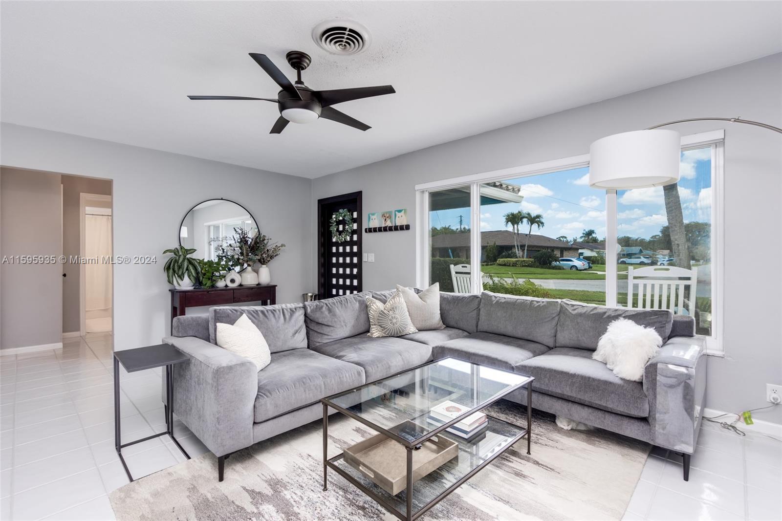 20 Burning Tree Lane Boca Raton, FL 33431 - Photo 19 of 64 a living room with furniture and a large window