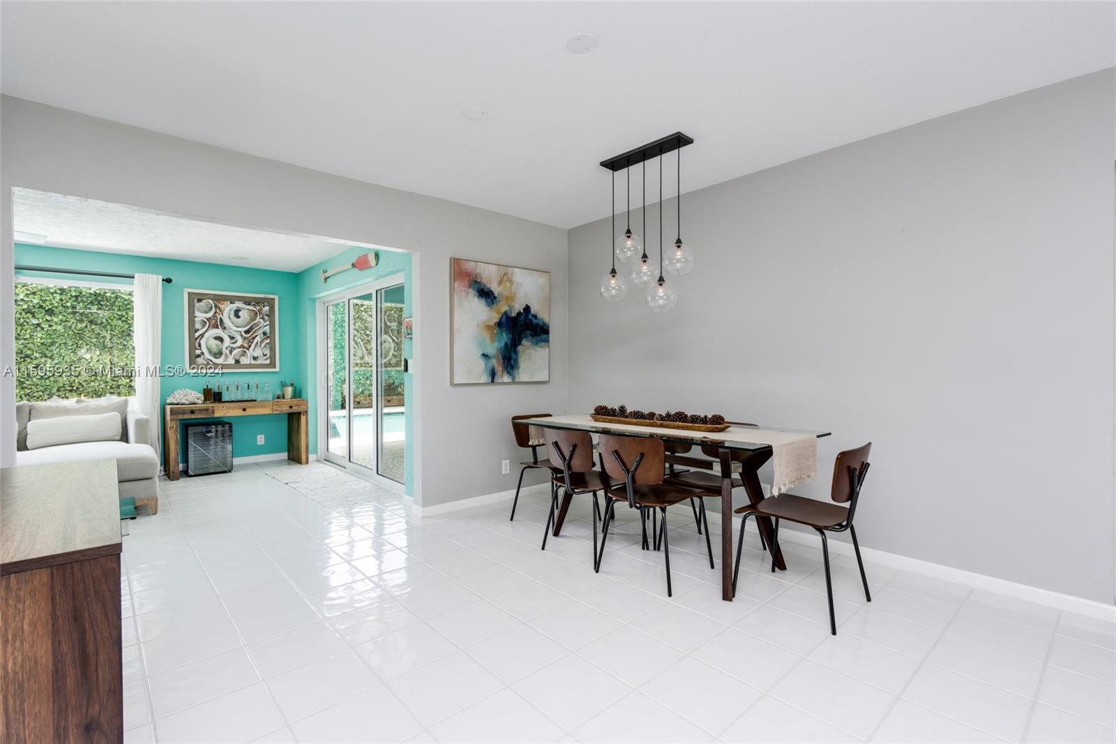 20 Burning Tree Lane Boca Raton, FL 33431 - Photo 22 of 64 a view of a dining room with furniture and a chandelier